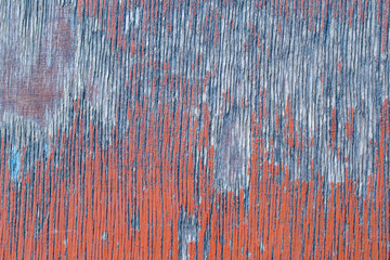 Wall of old plywood for the backdrop. Red paint, furrows in the wood.