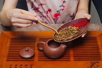 Woman takes part in a chinese tea ceremony