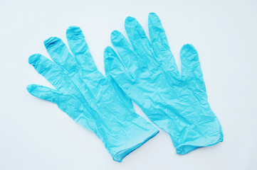 Blue medical gloves isolated on white background.