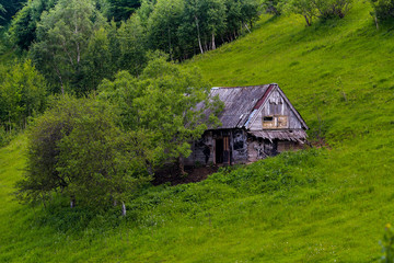 Fototapeta na wymiar Landscape with a wooden house, chalet