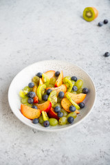 Fresh natural fruit salad bowl with Chia seeds