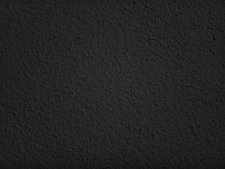 Black concrete abstract texture background. Dark backdrop. use design for product display or montage, advertising, food, beverages, technology, business, scary, horror, halloween. Top view