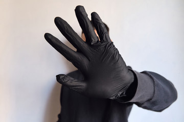 Man hands in black medical gloves closeup. Protecting the body from viruses and bacteria. Hand hygiene, sterile uniform. The fight against epidemic. Safety for your life. Prevention and control