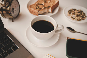cup of coffee and book on table