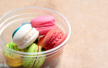 Colorful macaroon on ready serving on wood table background
