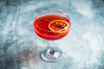 Blood oranges margarita on the rustic background. Selective focus. Shallow depth of field.