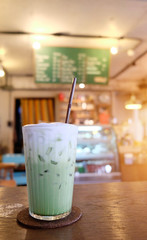 Green tea milk placed on the table in the cafe