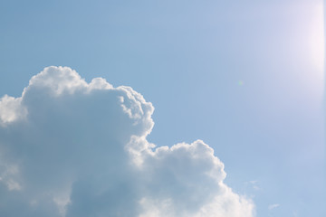 sun light through cloud on clear blue sky background