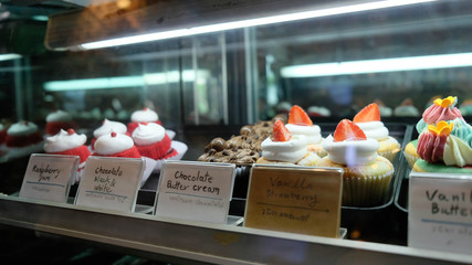 Beautiful cakes in the refrigerated display case  at the store