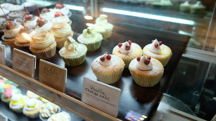 Beautiful cakes in the refrigerated display case  at the store