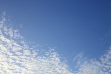 sunlight shiny through white cloud on blue sky background