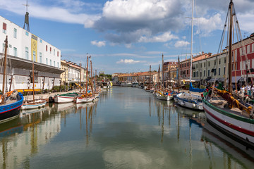 Fototapeta na wymiar The port canal designed by Leonardo da Vinci and old town of Cesenatico on the Adriatic sea coast