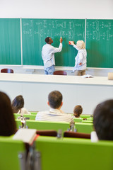 Student or pupil calculating math formula