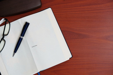 Home office table of laptop computer and blank paper background and copy space