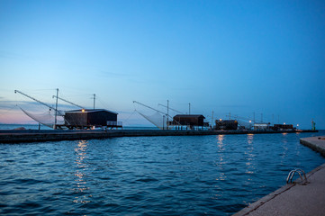 Obraz premium Trabucchi, particular fishing structures based on nets operated from wooden huts. Cesenatico, Emilia Romagna, Italy.