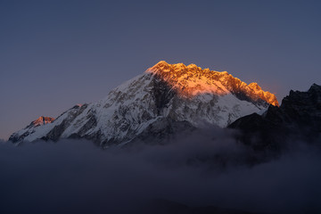 Beautiful Nuptse mountain peak at sunset view from Lobuche village in Everest region in Himalaya mountain range, Nepal