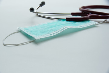 A hygenic mask and a stethoscope on the table