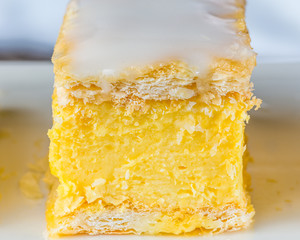 Vanilla Slice features puff pastry, custard and white icing sugar and is a favourite item in cafes all over the world.