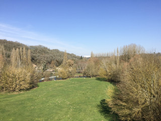 Fototapeta na wymiar Saint-Benoît green field view from stone bridge viaduct Poitou Charentes France