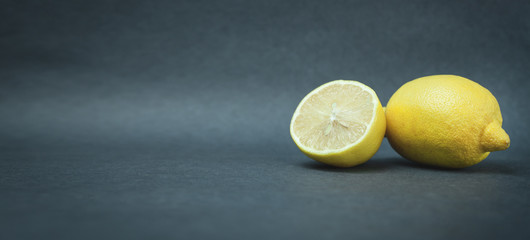 Lemon on dark blue background. Space for your text