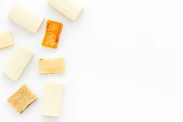 Soap bars flat lay on white background top-down copy space frame