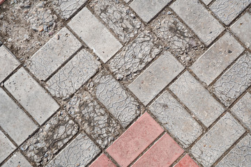 Background image of texture of pedestrian footpath covered by paving tiles