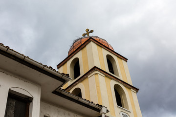 Fototapeta premium Cross on church tower and cloudy sky