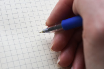 hand writes on a sheet