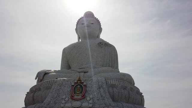 A statue of a large Buddha on a mountain in Phuket, Thailand