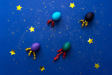 Fototapeta premium Color easter eggs over blue.