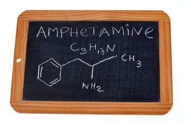 School slate on which is written the chemical formula of amphetamine