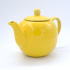 cup with tea and teapot on white  background, over light