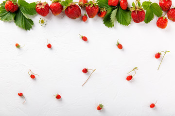 Fresh ripe strawberry berries on white background. Top view.