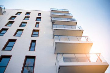 Modern apartment building flat estate concept. Outdoor residential facility at sunset and sunrise.