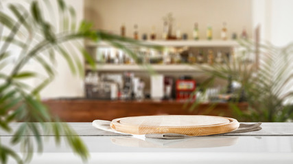 desk of free space and blurred bar interior 