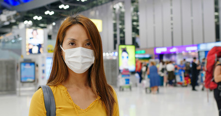 Asian Woman wear medical face mask at airport