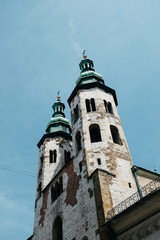 Fototapeta na wymiar Old churches towers on the blue sky