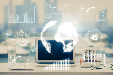Stock market graph on background with desk and personal computer. Multi exposure. Concept of financial analysis.