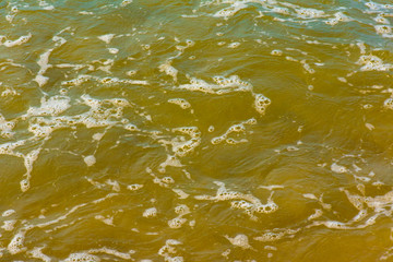 Blue sea water with white foam for background, nature background concept