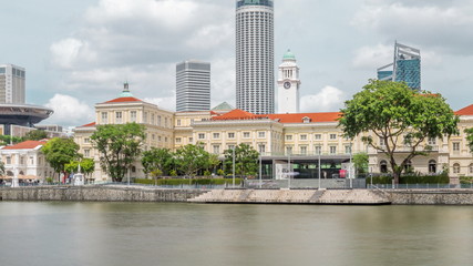 Fototapeta premium View of Singapore River with Asian Civilisation Museum and old civic district in background timelapse hyperlapse