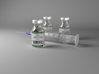 Three vials of flu vaccine with a syringe for treating seasonal flu