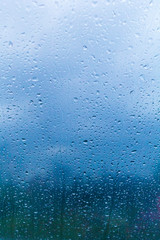 Water drops on window. Background of drops of water rain on glass transparent