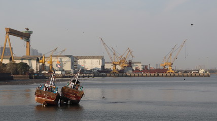 Mumbai, Maharastra/India- March 31 2020: The wooden boats sinking near the dockyard.