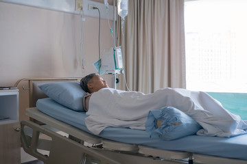 hospital patient rests alone, Lying on bed for recovering  sleeping in modern hospital ward. Health care service for illness concept