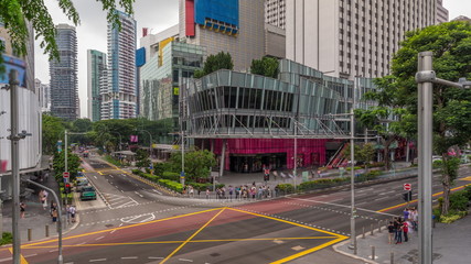 Aerial view of sidewalk and intersection of Orchard road in Singapore timelapse hyperlapse.