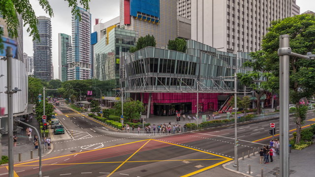 Aerial view of sidewalk and intersection of Orchard road in Singapore timelapse hyperlapse.