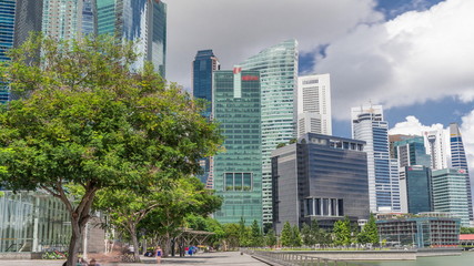 Fototapeta premium Business Financial Downtown City and Skyscrapers Tower Building at Marina Bay timelapse hyperlapse, Singapore,