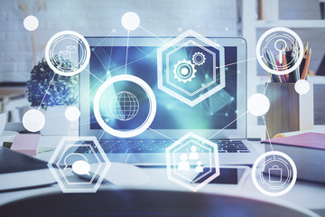 Computer on desktop with social network hologram. Multi exposure. Concept of international people connections.