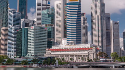 Naklejka premium Business Financial Downtown City and Skyscrapers Tower Building at Marina Bay timelapse, Singapore,