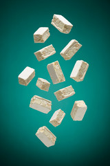 small nougat pieces flying on green background